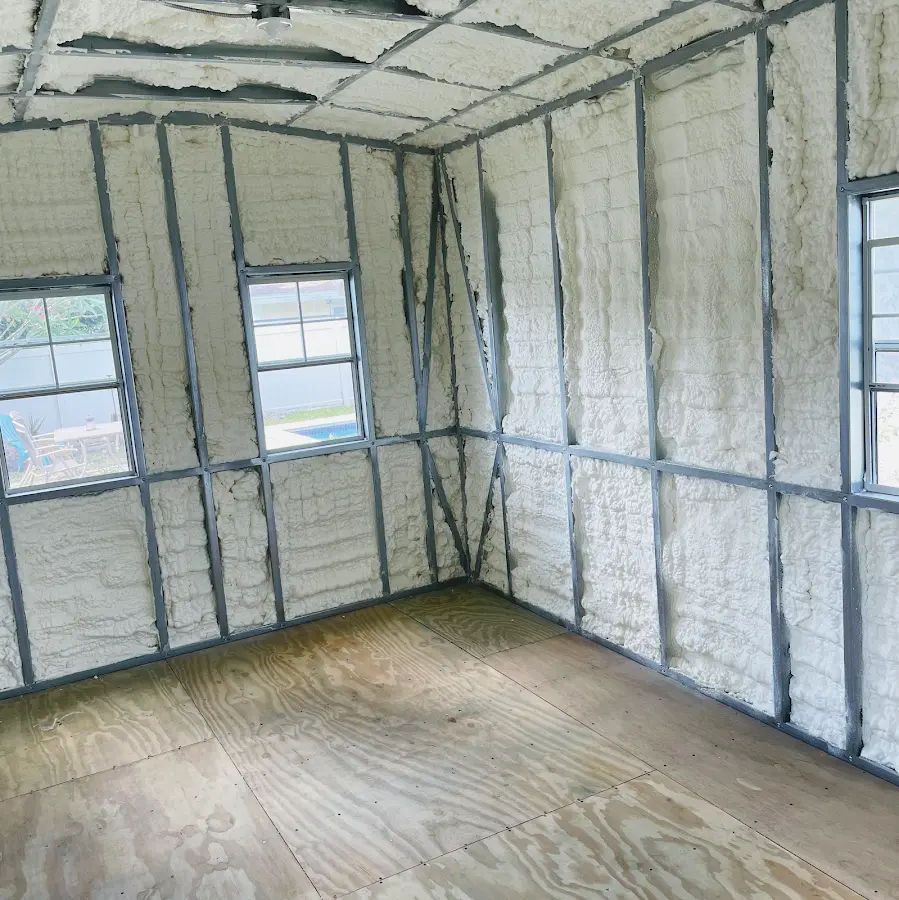 Closed-cell spray foam insulation applied to wall cavities in a residential project in Rye